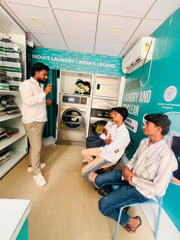 Classroom session with trainees seated in a Laundry Legend store
