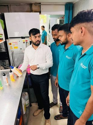 Trainer demonstrating finishing and quality inspection to trainees